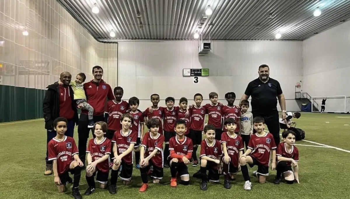 All Stars team photo on an indoor field