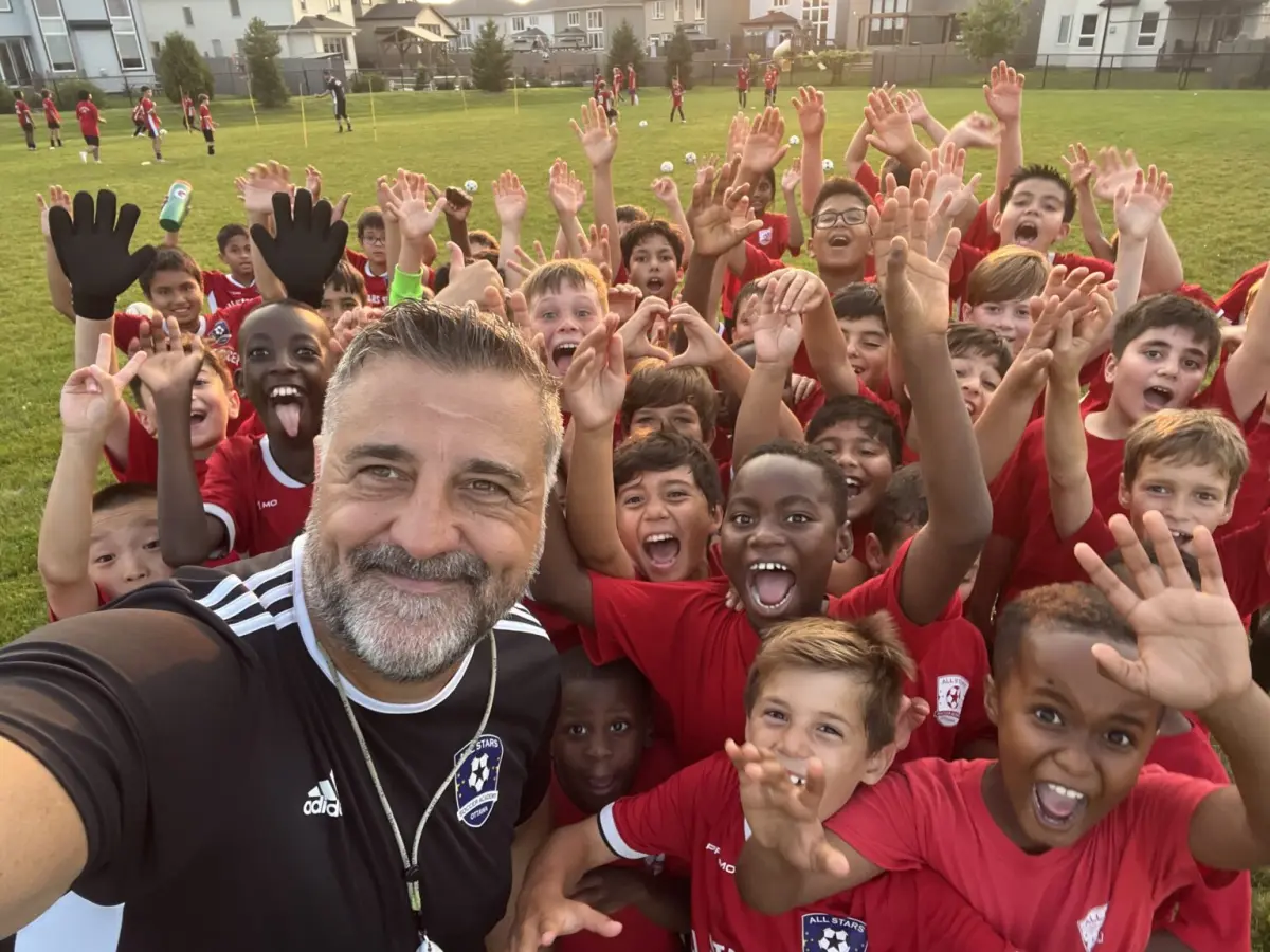 All Stars players celebrating with their coach